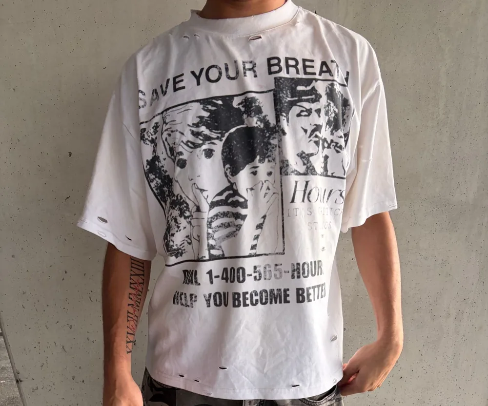 Close-up of the Pick Up The Phone tee print